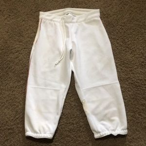 Ladies white Magestic softball pants with elastic drawstring waist. 14” across.